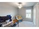 Cozy bedroom with chair and window offering a comfortable and relaxing space at 10115 Paradise Fish Dr, Riverview, FL 33578