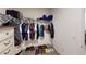 Walk-in closet with shelving and storage, providing ample space for clothes and accessories at 10115 Paradise Fish Dr, Riverview, FL 33578