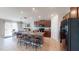 Open-concept kitchen with granite countertops, stainless steel appliances, a large island, and adjacent dining area at 10115 Paradise Fish Dr, Riverview, FL 33578