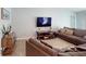 Bright and airy living room with comfortable seating, neutral decor, and tile flooring, creating a welcoming atmosphere at 10115 Paradise Fish Dr, Riverview, FL 33578