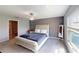 Serene bedroom with a queen-sized bed, soft lighting, and a calming gray color scheme at 10115 Paradise Fish Dr, Riverview, FL 33578