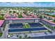 Aerial view of a well-maintained condo community with lush greenery, covered parking, and multiple buildings at 10215 Regal Dr # 45, Largo, FL 33774