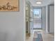 Inviting entryway with tile flooring and a view of the outdoors through a glass door at 10215 Regal Dr # 45, Largo, FL 33774