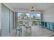 Serene Florida room with expansive windows and comfortable seating, perfect for relaxation at 10215 Regal Dr # 45, Largo, FL 33774