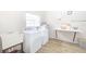 A clean laundry room with modern washing machines, sink, and folding area at 10215 Regal Dr # 45, Largo, FL 33774