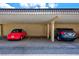 Assigned covered parking with ample space for two cars in a well-maintained carport at 10215 Regal Dr # 45, Largo, FL 33774