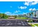 Beautiful view of the waterway from this condo community, featuring tropical landscaping and blue skies at 10215 Regal Dr # 45, Largo, FL 33774