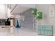 Close up of kitchen with light backsplash with quartz counters and decor with beach themed accessories at 10216 Regal Dr # 405, Largo, FL 33774