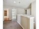 Upstairs hallway with neutral paint, carpet, and access to bathroom and bedrooms at 10222 Newminster Loop, Ruskin, FL 33573