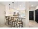 Open-concept kitchen with bar seating seamlessly flows into the living area for easy entertaining at 11320 Harbor Way # 1725, Largo, FL 33774