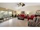 Bright and airy living room with access to a balcony, offering comfortable seating and a relaxing atmosphere at 11320 Harbor Way # 1725, Largo, FL 33774