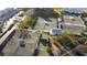 Aerial shot of multiple well-maintained tennis courts, with parking, benches, and manicured landscaping at 11320 Harbor Way # 1725, Largo, FL 33774