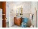 Bathroom featuring a vanity, mirror, toilet, and wallpaper at 11601 86Th Ave, Seminole, FL 33772