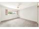 Bright bedroom with large windows, a ceiling fan, and neutral carpet at 11601 86Th Ave, Seminole, FL 33772