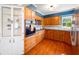 Modern kitchen with stainless appliances, wooden cabinetry, and ample counter space, perfect for cooking at 11601 86Th Ave, Seminole, FL 33772