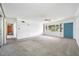 Bright living room with large window and ceiling fan, freshly painted and carpeted at 11601 86Th Ave, Seminole, FL 33772