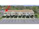 Aerial view of the townhome row with designated parking at 1256 Redondo Way, Wesley Chapel, FL 33543