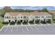 Aerial view of the townhome row with designated parking at 1256 Redondo Way, Wesley Chapel, FL 33543