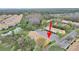 Aerial view of the townhome complex with beautiful natural surroundings at 1256 Redondo Way, Wesley Chapel, FL 33543