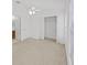 Spacious carpeted bedroom featuring ceiling fan and a walk-in closet at 1256 Redondo Way, Wesley Chapel, FL 33543