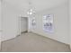 Carpeted bedroom featuring a ceiling fan, a closet and two windows at 1256 Redondo Way, Wesley Chapel, FL 33543