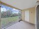 View from screened patio showing lush trees and outdoor space at 1256 Redondo Way, Wesley Chapel, FL 33543