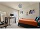 Cozy bedroom with neutral walls, carpet, and a comfortable workspace near the window at 1426 Main St, Valrico, FL 33594