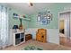 Bright bedroom featuring carpet floors, white wainscoting, playful decor, and ample storage at 1426 Main St, Valrico, FL 33594