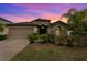 Charming single Gathering home featuring a stone facade, mature landscaping and a two car garage at 1426 Main St, Valrico, FL 33594