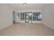 Open-concept living room features tile flooring and sliding glass doors to the outside at 1535 Satsuma St, Clearwater, FL 33756