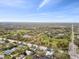 Expansive aerial view of the neighborhood highlighting the lush green landscape and nearby roadways at 1621 S Keene Rd, Clearwater, FL 33756