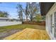 Large backyard features a wooden deck, white vinyl fence, and mature trees at 1621 S Keene Rd, Clearwater, FL 33756