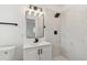 Modern bathroom with rainfall shower, marble-look tile, and updated vanity at 1621 S Keene Rd, Clearwater, FL 33756