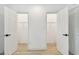 Double closets with open doors reveal plenty of storage and wood-look floors at 1621 S Keene Rd, Clearwater, FL 33756