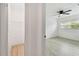 Hallway view from bedroom to walk-in closet with wire shelving at 1621 S Keene Rd, Clearwater, FL 33756