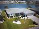 Charming single-story home with landscaped yard and waterfront view of the lake at 1815 Fort Duquesna Dr, Sun City Center, FL 33573