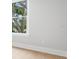 Bedroom showing a white wall and window with white trim at 216 N Hesperides St, Tampa, FL 33609