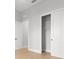 Bedroom with open closet space and light-colored wood floors at 216 N Hesperides St, Tampa, FL 33609