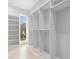 Walk-in closet with shelves and hangers at 216 N Hesperides St, Tampa, FL 33609