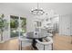 Bright dining area adjacent to modern kitchen with sliding glass doors at 216 N Hesperides St, Tampa, FL 33609