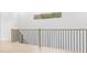 Hallway showcasing a sleek black railing and an abundance of natural light at 216 N Hesperides St, Tampa, FL 33609