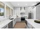 Gourmet kitchen features a large island, stainless steel appliances, and stylish finishes at 216 N Hesperides St, Tampa, FL 33609