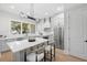 Modern kitchen boasts a large island with bar seating and stainless steel appliances at 216 N Hesperides St, Tampa, FL 33609