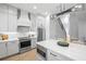 Well-equipped kitchen with stainless appliances, ample counter space, and modern lighting at 216 N Hesperides St, Tampa, FL 33609
