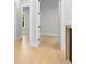 Hallway featuring hardwood floors, and neutral color palette and white trim at 222 N Hesperides St, Tampa, FL 33609