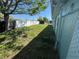 View of the backyard with lawn and partial fencing at 2344 Tahitian Dr, Holiday, FL 34691