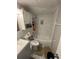 Cozy bathroom features tiled walls, tub with shower, and sink vanity at 2344 Tahitian Dr, Holiday, FL 34691