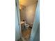 Small bathroom with a toilet, sink and marble-like floor at 2344 Tahitian Dr, Holiday, FL 34691