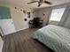 Bedroom features wood-look flooring and ceiling fan at 2344 Tahitian Dr, Holiday, FL 34691