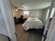 The bedroom has a ceiling fan, a large window, and laminate floors at 2344 Tahitian Dr, Holiday, FL 34691